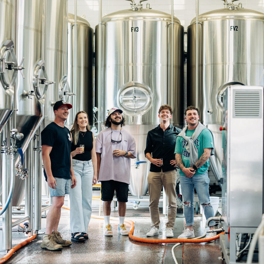 People standing in the brewery during a tour at Lovedale Bar + Grill